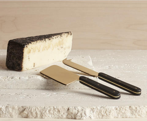 brass and wood cheese servers at maeree