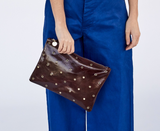 clare v walnut grommet flat clutch with tabs at maeree